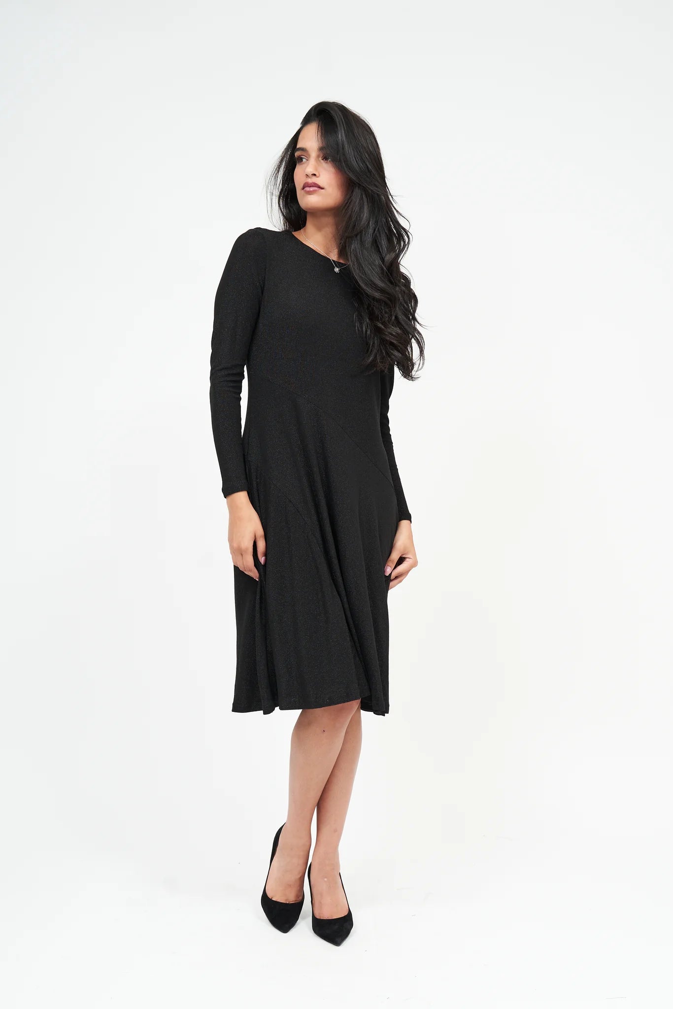 Woman wearing a black dress on a white background